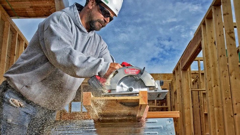 Construction Worker using a circular saw