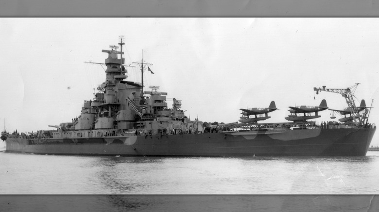 The USS South Dakota with several seaplanes on its deck