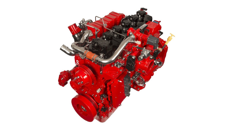 Cummins B6.7 Natural Gas engine in signature red, featuring visible turbocharger and fuel system components.