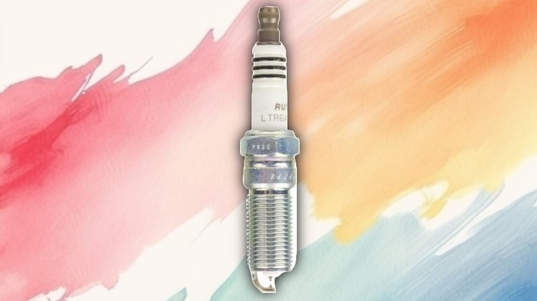 A ruthenium spark plug on a painted background.