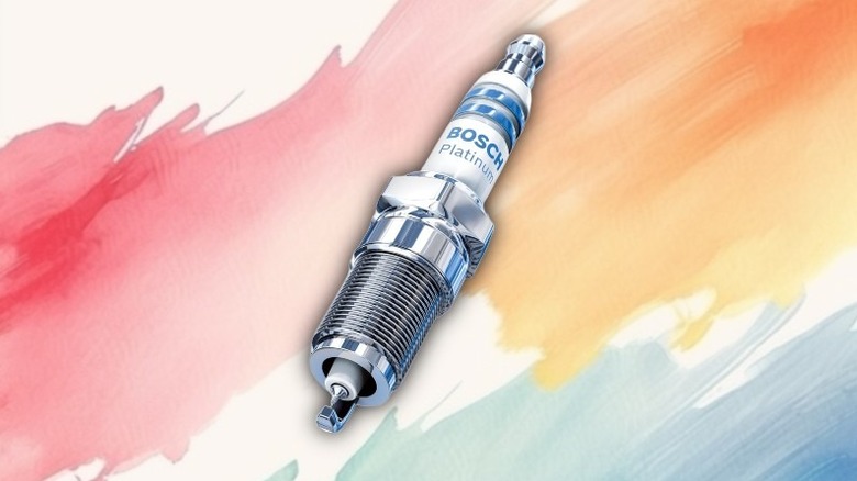 A single platinum spark plug on a painted background.