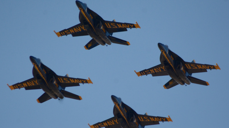 Boeing F/A-18 Super Hornet fighter jets of the US Navy Blue Angels flying in diamond formation