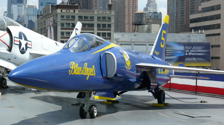Grumman F11F-1 Tiger in Blue Angels colors on display outdoors at Intrepid Sea-Air-Space Museum