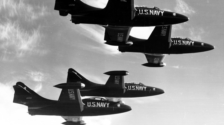 Grumman F9F-5 Panther fighter jets of the US Navy Blue Angels flying in formation during a show in 1954