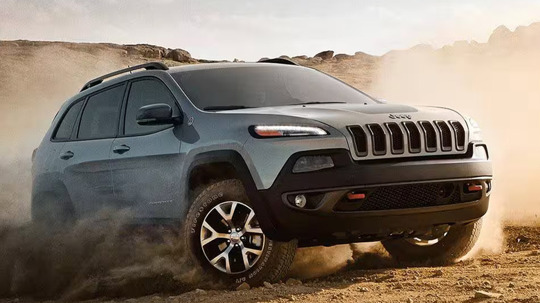 A fifth generation Cherokee driving through the dirt