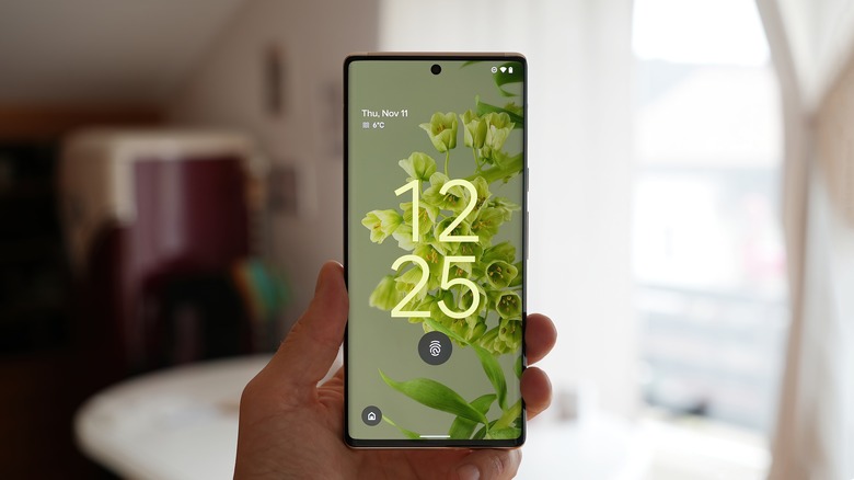 holding up a google pixel 6 pro smartphone