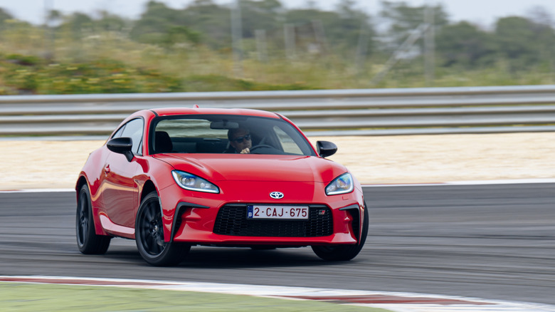 2022 Toyota GR86 drifting on track front 3/4 view