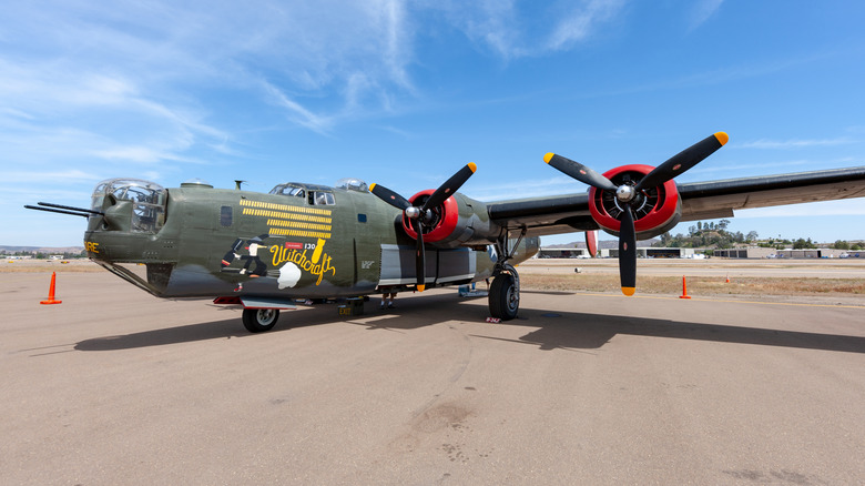 Green Consolidated B-24 Liberator on runway