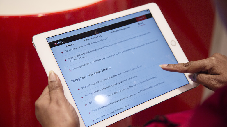 woman touching an ipad
