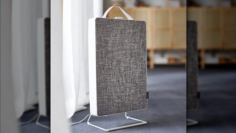 Floor mounted air purifier with top handle