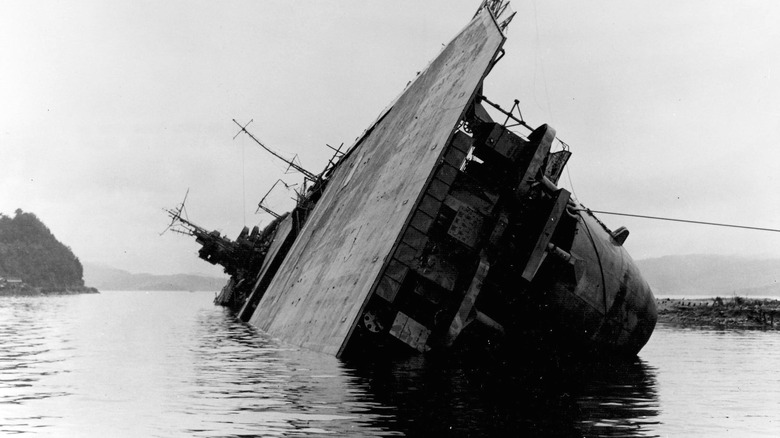 Japanese aircraft carrier Amagi capsized at Kure Naval Arsenal in 1945