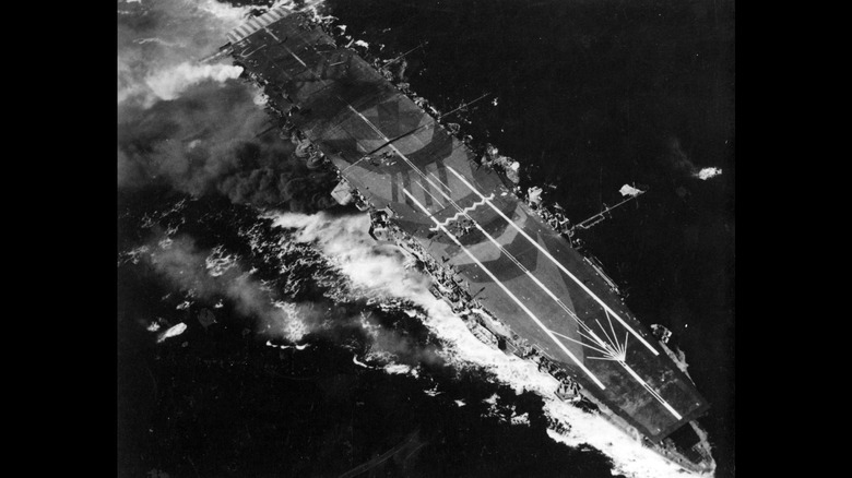 Japanese aircraft carrier Zuhio taking damage during Battle of Cape Engano