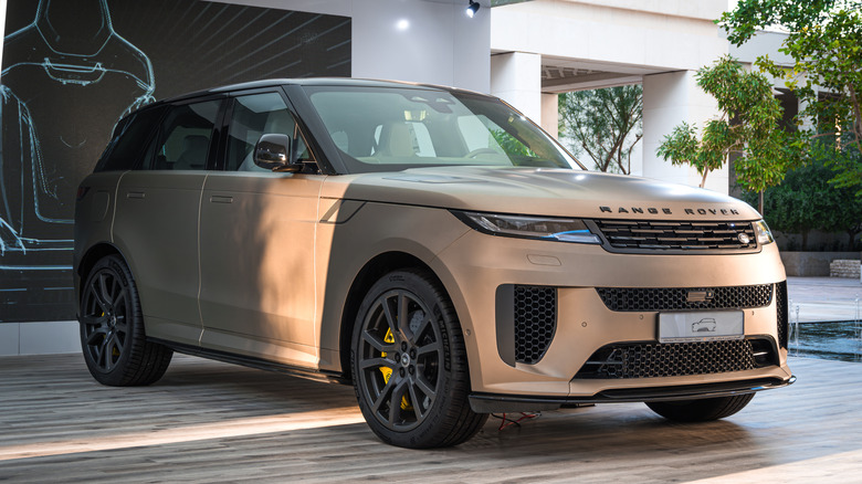A beige colored Range Rover Sport from the 2024 model year displayed in Qatar
