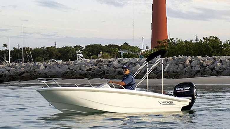 A Boston Whaler 130 Super Short near a lighthouse