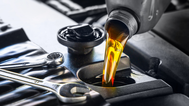 Motor oil being poured into an engine