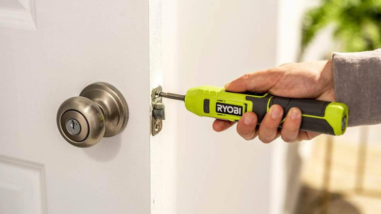 Ryobi's 4V Cordless 1/4 in. Screwdriver used to mount a lock to a door.