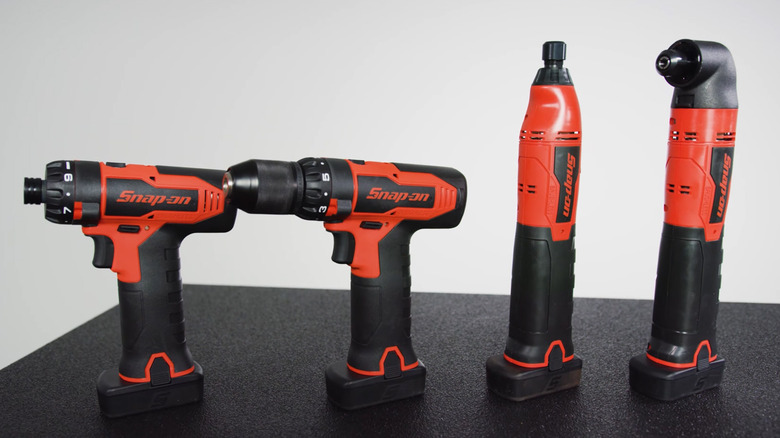 Four Snap-on power tools on a work bench table