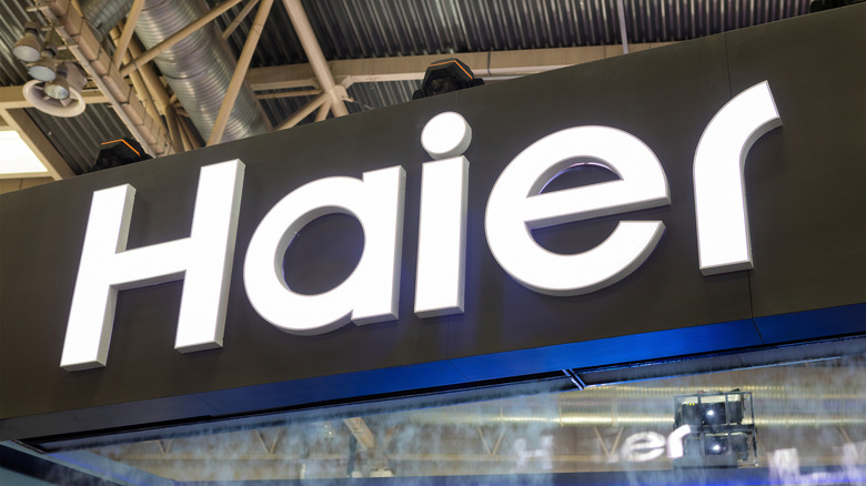 A Haier sign above store
