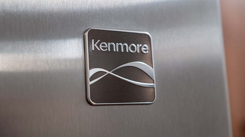 A closeup of Kenmore logo on appliance