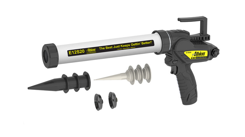 An Albion brand electric caulk gun with accessories