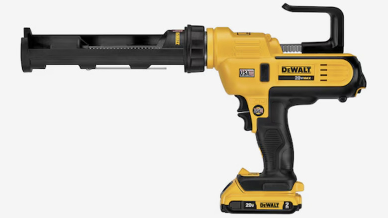 A DeWalt brand electric caulk gun stock image