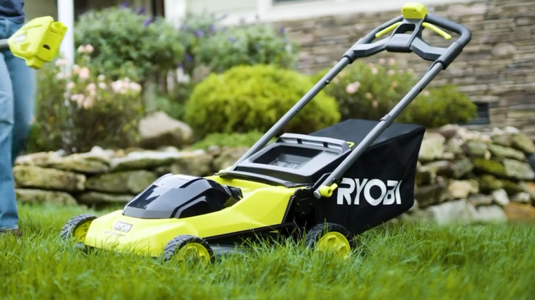 Ryobi sitting on a front lawn outside a house
