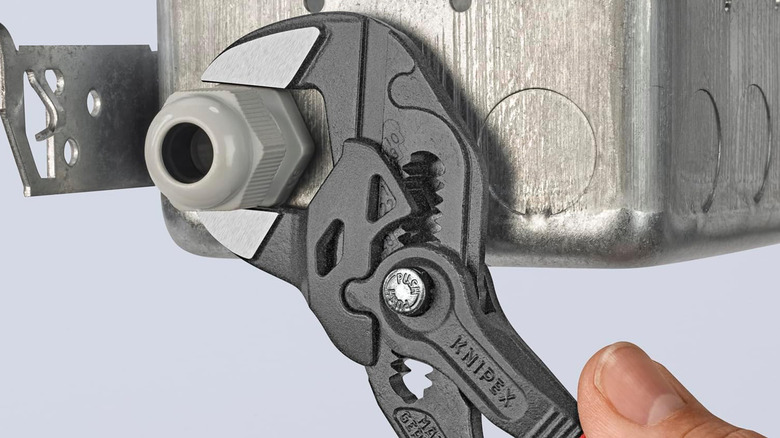 A Knipex Pliers Wrench tightening a bolt