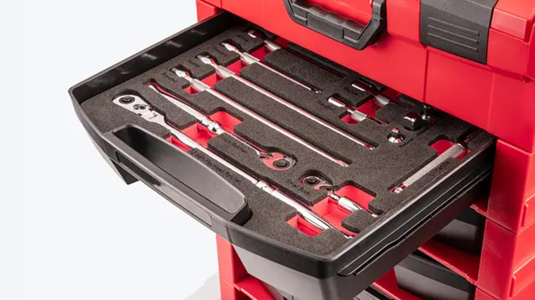 A Tekton toolbox filled with tools organized in foam cutouts.