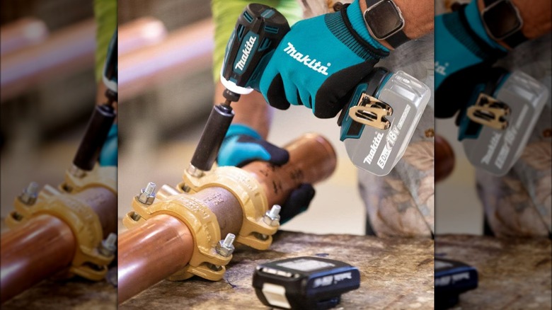 a Makita impact driver in action