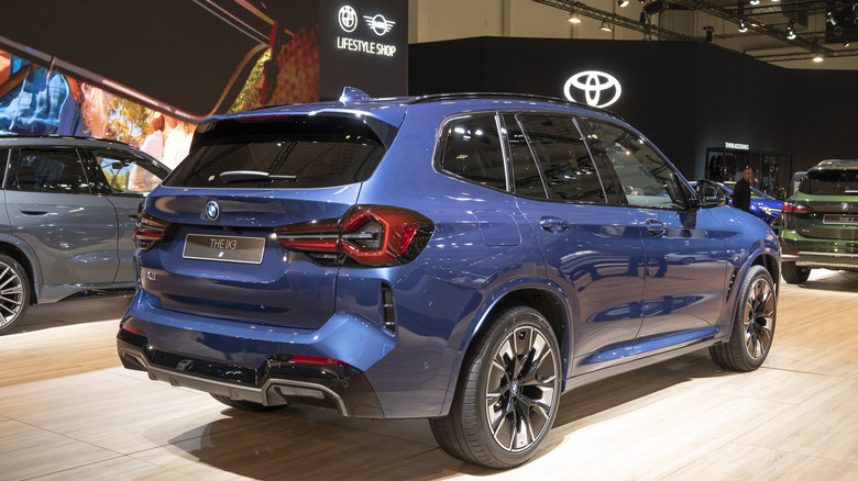 Blue BMW iX3 in dealership
