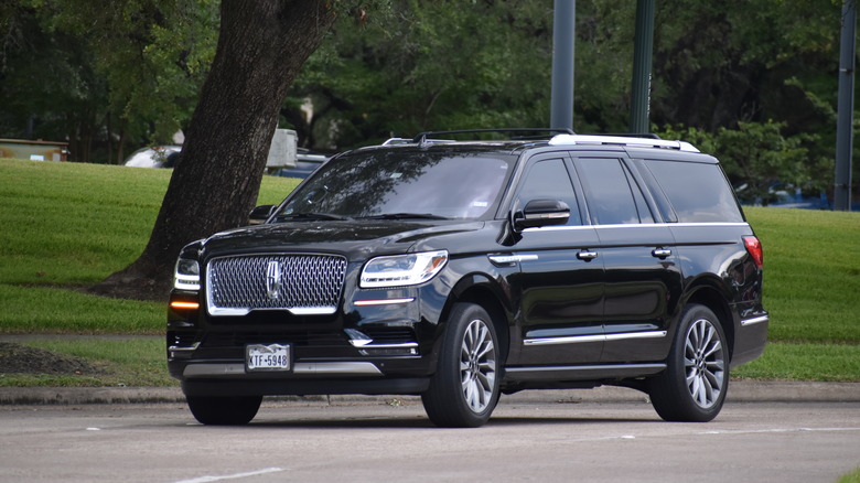Black Lincoln Navigator on road