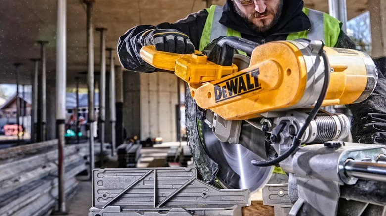 cutting on jobsite with DeWalt miter saw