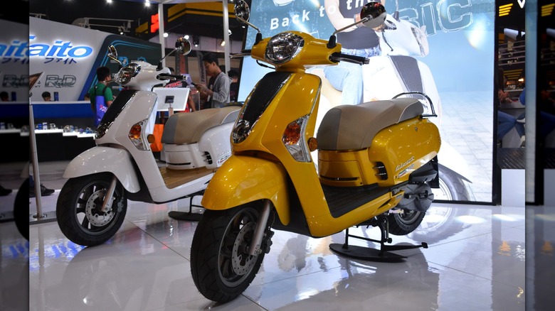 Kymco scooters on display stand