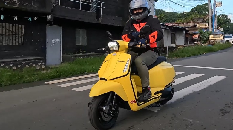 Man riding Lambretta X200 on street
