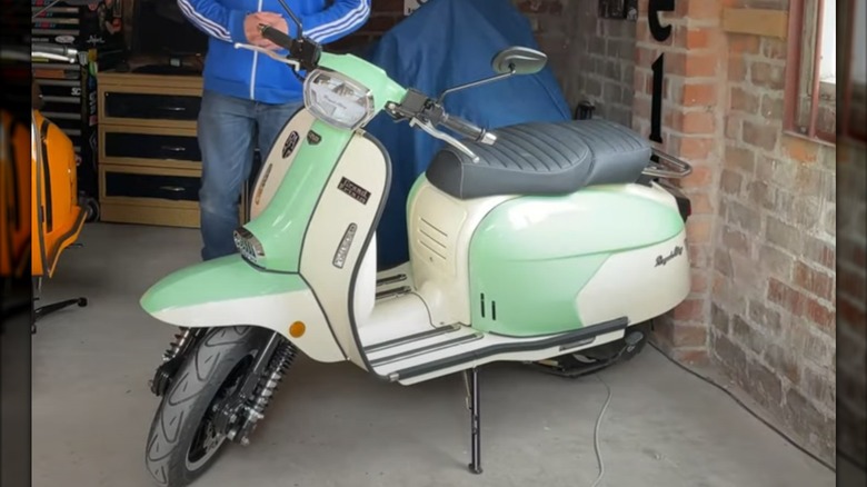 Royal Alloy scooter in garage