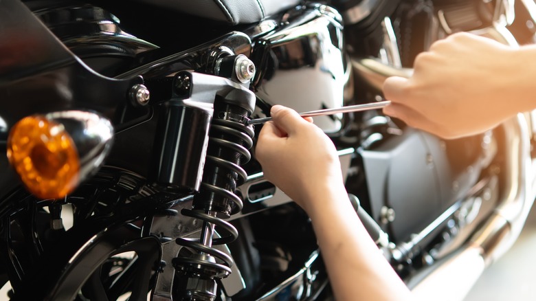 Person working on a motorcycle