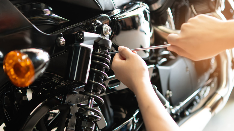 Person working on a motorcycle