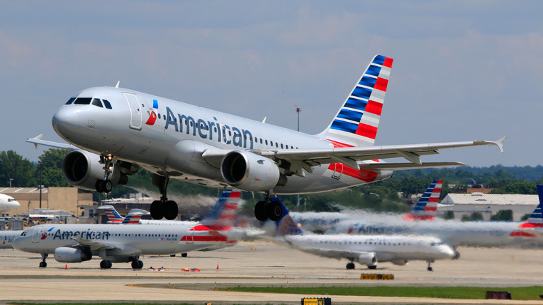 american airplane taking off at airport