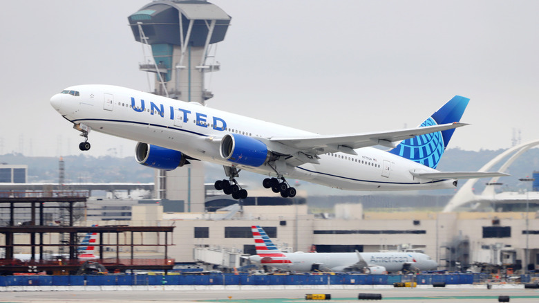 united airplane taking off at airport
