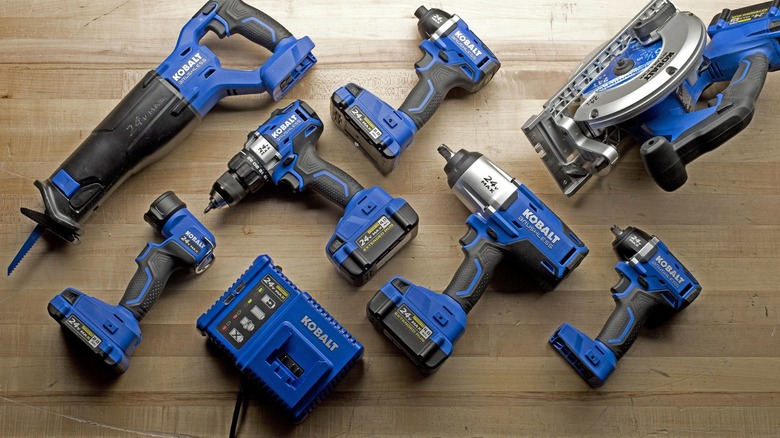A collection of Kobalt power tools on a table