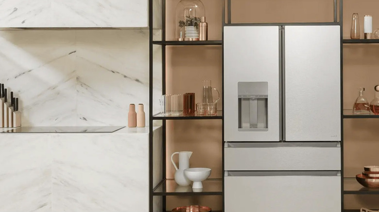 A Café fridge in an upscale kitchen with shelves