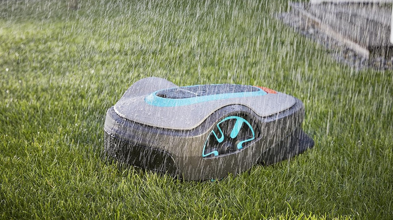 A Sileno Life robot mower by Gardena in the rain.