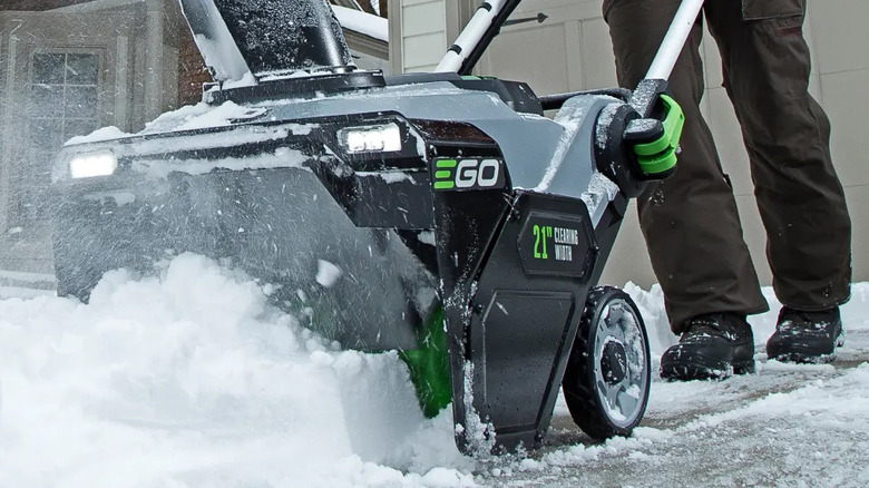 Closeup of an Ego snow blower in function