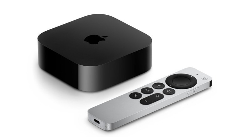 Apple TV 4K and remote on white background