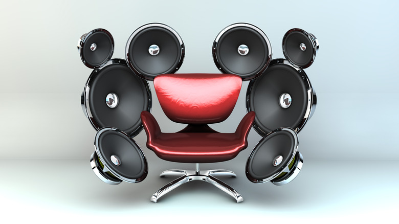 Red chair surrounded by speakers