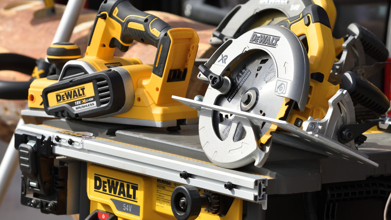 DeWalt power tools on a table saw