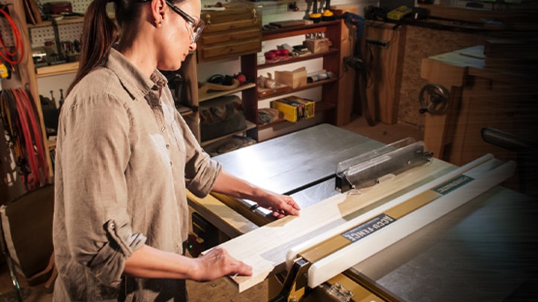 woodworker using a Powermatic table saw