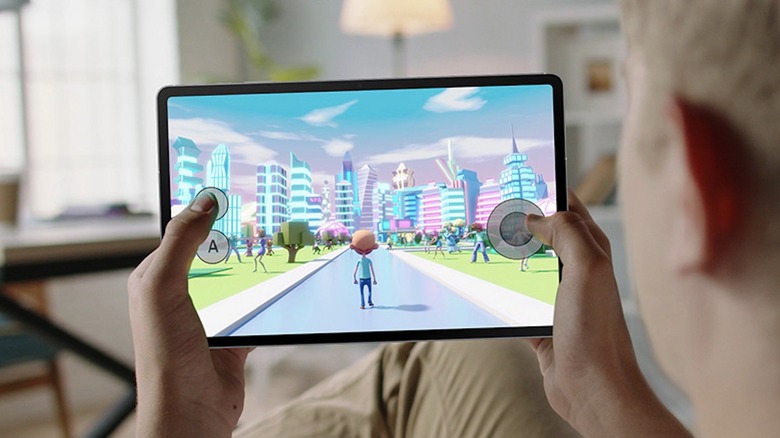 Person gaming on a Samsung Galaxy Tab S10 FE