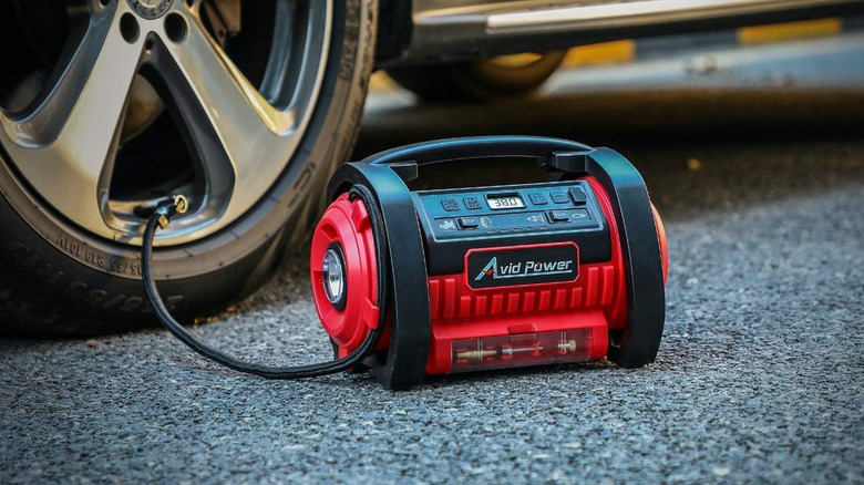 AVID POWER Tire Inflator in use with a car