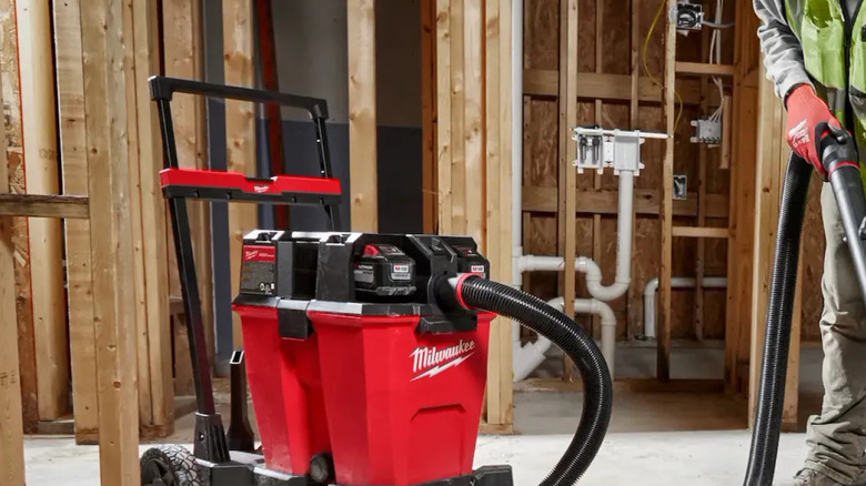 The M18 Fuel 12 Gallon Dual-Battery Wet/Dry Vacuum by Milwaukee in a building in construction